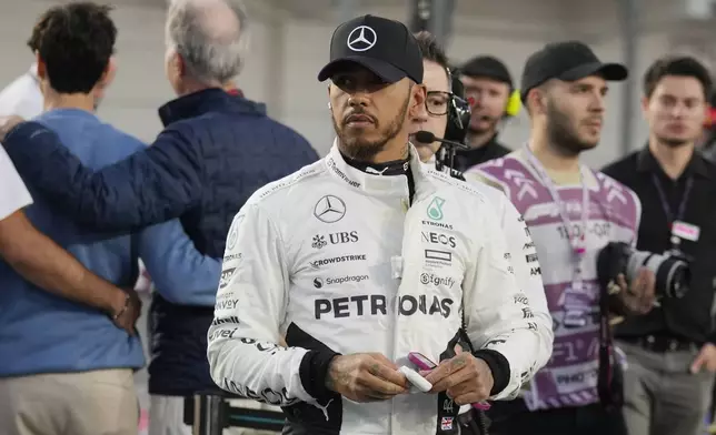 Mercedes driver Lewis Hamilton of Britain prepares prior to the start of the sprint race at the Formula One Qatar Grand Prix, at the Lusail International Circuit in Lusail, Qatar, Saturday, Nov. 30, 2024. (AP Photo/Pool/ Altaf Qadri)