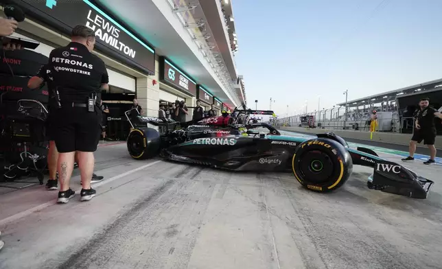 Mercedes driver Lewis Hamilton of Britain leaves the pit during practice at the Lusail International Circuit in Lusail, Qatar, ahead of the Qatar Formula One Grand Prix, Friday, Nov. 29, 2024. (AP Photo/Darko Bandic)