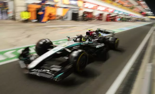 Mercedes driver Lewis Hamilton of Britain leaves the pit during sprint qualifying at the Lusail International Circuit in Lusail, Qatar, ahead of the Qatar Formula One Grand Prix, Friday, Nov. 29, 2024. (AP Photo/Darko Bandic, Pool)