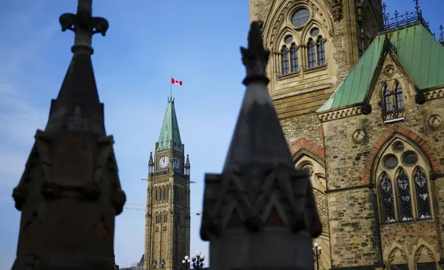 FILE - The Canada Flag flies atop the Peace Tower on Parliament Hill in Ottawa on Oct. 30, 2024. (Sean Kilpatrick/The Canadian Press via AP, File)