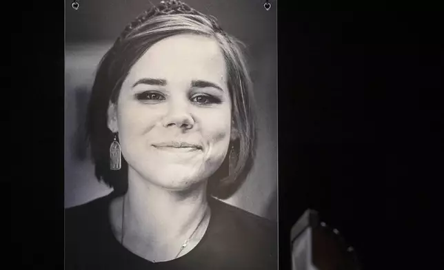 FILE - A portrait of Daria Dugina is seen as relatives hold her memorial service in Moscow, Russia, on Aug. 23, 2022. (AP Photo/Dmitry Serebryakov, File)