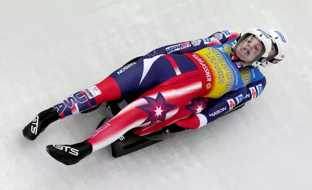 Chevonne Chelsea Forgan and Sophia Kirkby of the United States compete during the women's sprint race at the Luge World Cup in Igls near Innsbruck, Austria, Saturday, Dec. 7, 2024. (AP Photo/Matthias Schrader)