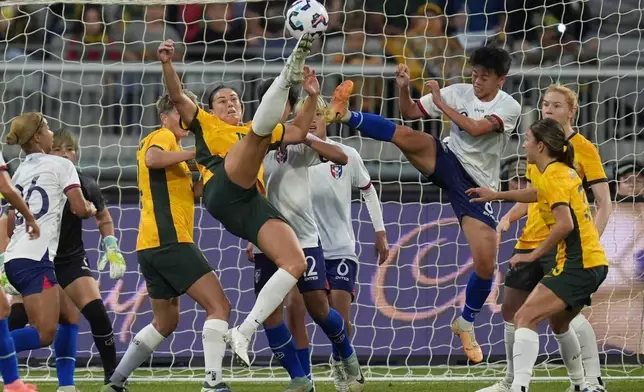 Matilda's Emily Gielnik and Taiwan's Li Yi-wen compete to kick the ball during a friendly soccer international between Australia and Taiwan in Geelong, Australia, Saturday, Dec. 7, 2024. (AP Photo/Asanka Brendon Ratnayake)