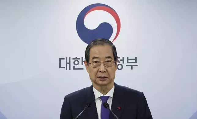 South Korea's acting President Han Duck-soo speaks at the government complex in Seoul, South Korea, Thursday, Dec. 26, 2024. (Choi Jae-koo/Yonhap via AP)