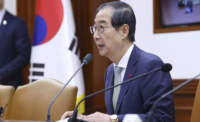 South Korea's Prime Minister Han Duck-soo, who became the country's acting leader after parliament’s impeachment of President Yoon Suk Yeol, speaks during a meeting at the government complex in Seoul, South Korea, Thursday, Dec. 19, 2024. (Han sang-kyun/Yonhap via AP)