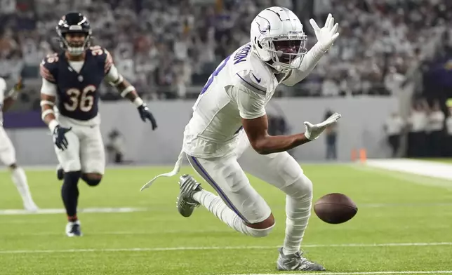 Minnesota Vikings wide receiver Justin Jefferson (18) reaches for an incomplete pass during the first half of an NFL football game against the Chicago Bears, Monday, Dec. 16, 2024, in Minneapolis. (AP Photo/Abbie Parr)