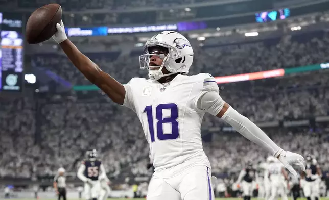 Minnesota Vikings wide receiver Justin Jefferson celebrates after catching a 7-yard touchdown pass during the first half of an NFL football game against the Chicago Bears, Monday, Dec. 16, 2024, in Minneapolis. (AP Photo/Abbie Parr)