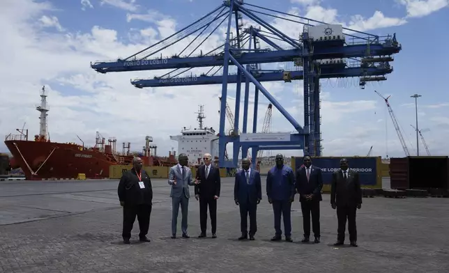 Angolan Minister of Transport Ricardo Daniel speaks to President Joe Biden accompanied by, from his left, President Joao Lourenco of the Republic of Angola, President Felix Tshisekedi of the Democratic Republic of the Congo, President Hakainde Hichilema of the Republic of Zambia and Vice President Philip Mpango of the United Republic of Tanzania during a tour of the Lobito Port Terminal, in Lobito, Angola, on Wednesday, Dec. 4, 2024. (AP Photo/Ben Curtis)