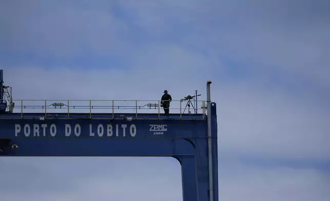 A sniper stands on a platform during President Joe Biden's tour of he Lobito Port Terminal in Lobito, Angola, on Wednesday, Dec. 4, 2024. (AP Photo/Ben Curtis)