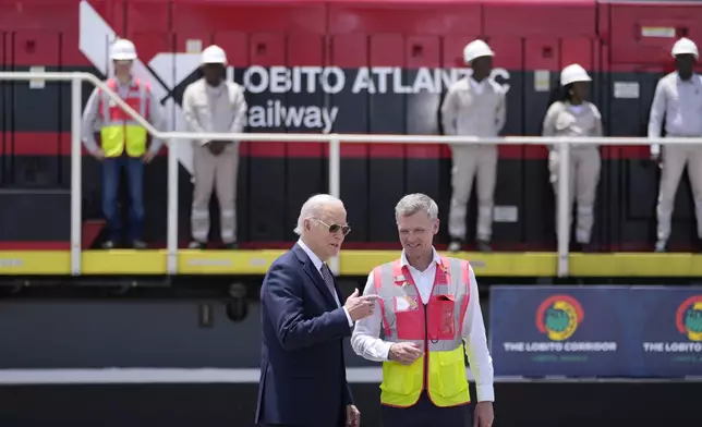 President Joe Biden and Chief Operating Officer of Lobito Atlantic Railway Nicolas Gregoire tour the Lobito Port Terminal in Lobito, Angola, on Wednesday, Dec. 4, 2024. (AP Photo/Ben Curtis)