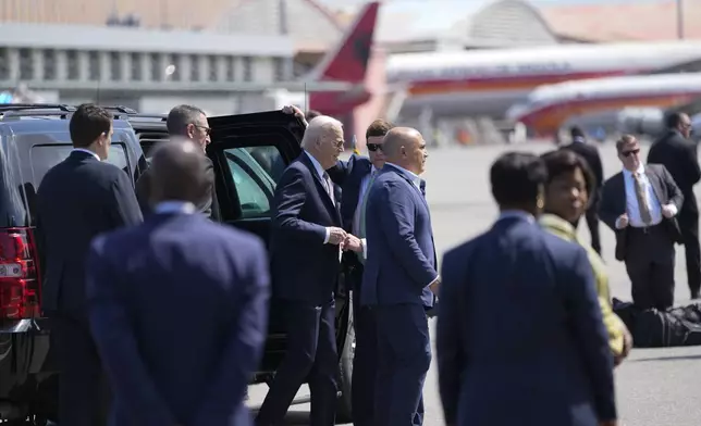 President Joe Biden walks to board Air Force One at Quatro de Fevereiro International Airport in the capital, Luanda, Angola, on Wednesday, Dec. 4, 2024. (AP Photo/Ben Curtis)