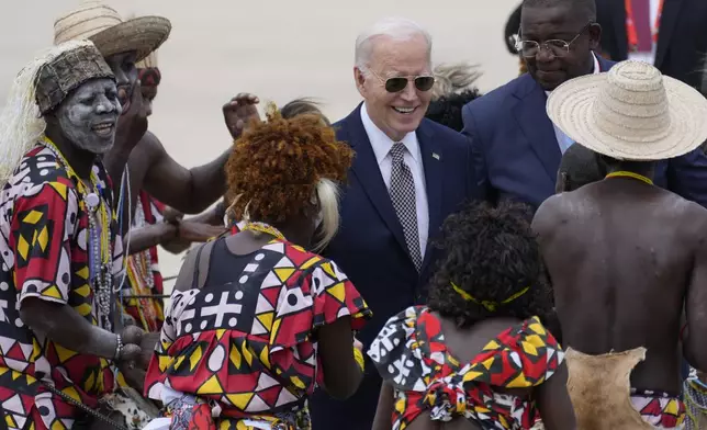 President Joe Biden watches a traditional dance after arriving at Catumbela airport in Angola on Wednesday, Dec. 4, 2024. (AP Photo/Ben Curtis)