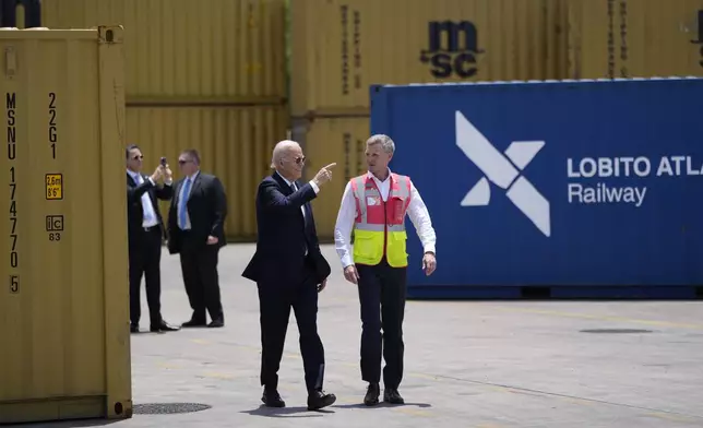 President Joe Biden and Chief Operating Officer of Lobito Atlantic Railway Nicolas Gregoire tour the Lobito Port Terminal in Lobito, Angola, on Wednesday, Dec. 4, 2024. (AP Photo/Ben Curtis)