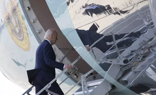 President Joe Biden boards Air Force One at Quatro de Fevereiro International Airport in Luanda, Angola, on Wednesday, Dec. 4, 2024. (AP Photo/Ben Curtis)