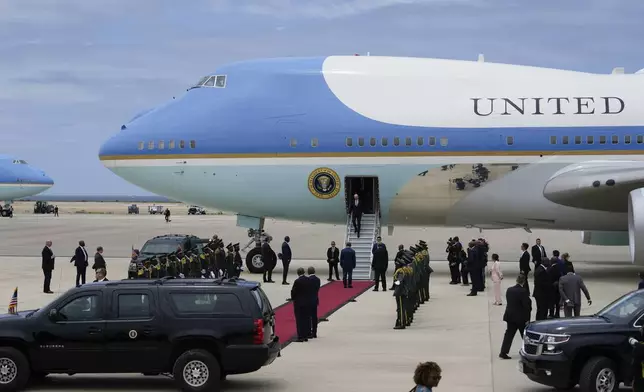 President Joe Biden disembarks Air Force One after arriving at Catumbela airport in Angola on Wednesday, Dec. 4, 2024. (AP Photo/Ben Curtis)