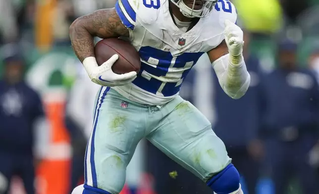 Dallas Cowboys running back Rico Dowdle runs the ball against the Philadelphia Eagles during the second half of an NFL football game, Sunday, Dec. 29, 2024, in Philadelphia. (AP Photo/Matt Slocum)