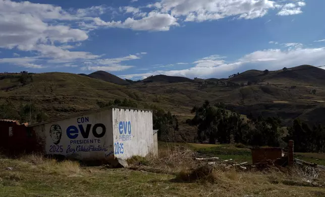 FILE - The wall of a home is covered in the Spanish words: "Evo President 2025," referring to former President Evo Morales in Colomi, Bolivia, Nov. 9, 2024. (AP Photo/Juan Karita, File)