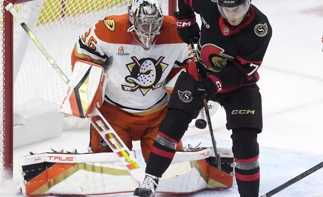 Ottawa Senators' Ridly Greig tries to tip the puck past Anaheim Ducks goaltender John Gibson during the first period of an NHL hockey game, Wednesday, Dec. 11, 2024 in Ottawa, Ontario. (Adrian Wyld/The Canadian Press via AP)