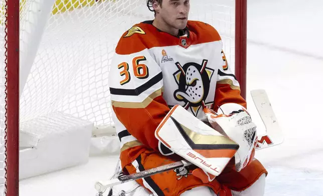 Anaheim Ducks goaltender John Gibson sits in his crease after allowing a third goal to the Ottawa Senators during the first period of an NHL hockey game, Wednesday, Dec. 11, 2024 in Ottawa, Ontario. (Adrian Wyld/The Canadian Press via AP)