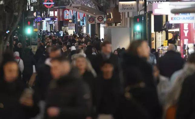 Christmas shoppers in central London, Friday, Dec. 13, 2024, Britain's economy unexpectedly shrank by 0.1 percent in October, The Office for National Statistics stated in figures released Friday. (AP Photo/Alberto Pezzali)