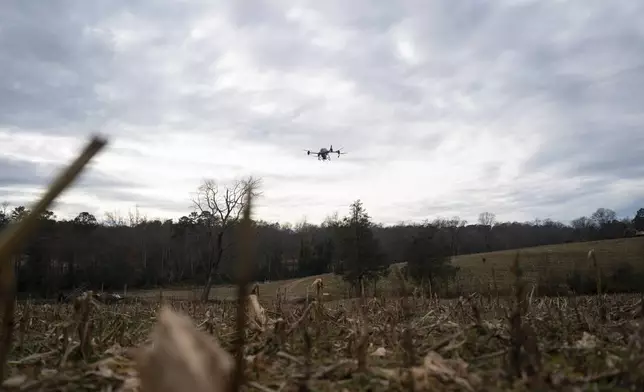 Russell Hedrick's DJI drone puts crop cover on his farm, Tuesday, Dec. 17, 2024, in Hickory, N.C. (AP Photo/Allison Joyce)