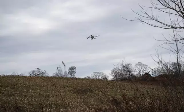 Russell Hedrick's DJI drone puts crop cover on his farm, Tuesday, Dec. 17, 2024, in Hickory, N.C. (AP Photo/Allison Joyce)