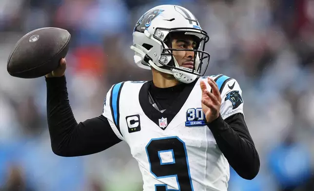 Carolina Panthers quarterback Bryce Young passes against the Dallas Cowboys during the second half of an NFL football game, Sunday, Dec. 15, 2024, in Charlotte, N.C. (AP Photo/Jacob Kupferman)
