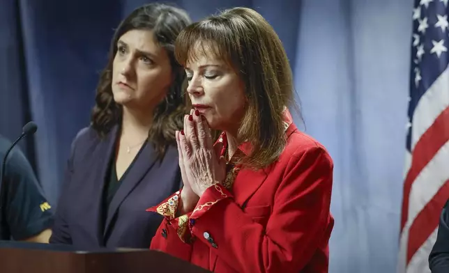 State Attorney Katherine Fernandez Rundle, right, reacts as she speaks during a press conference at the State Attorney's Office, in Miami, Wednesday, Dec. 11, 2024, regarding the arrest of the Alexander twin brothers and suspect at large Ohad Fisherman for their sexual assault allegations in Miami Beach. Natalie Snyder, left, Division Chief of the Sexual Battery and Child Abuse Unit of the State Attorney's Office for Miami-Dade County, listens. (Al Diaz/Miami Herald via AP)