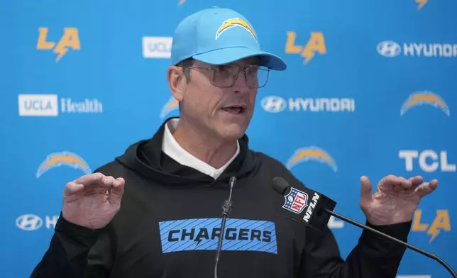 Los Angeles Chargers head coach Jim Harbaugh speaks during a news conference following an NFL football game against the Kansas City Chiefs Sunday, Dec. 8, 2024, in Kansas City, Mo. (AP Photo/Ed Zurga)