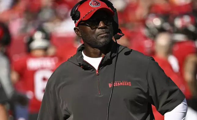 Tampa Bay Buccaneers head coach Todd Bowles walks on the sidelines during the first half of an NFL football game against the Las Vegas Raiders, Sunday, Dec. 8, 2024, in Tampa, Fla. (AP Photo/Jason Behnken)