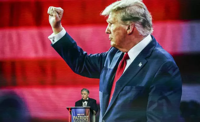 Sean Hannity introduces President-elect Donald Trump before awarding him the 'Patriot of the Year' award at the FOX Nation Patriot Awards, Thursday, Dec. 5, 2024, in Greenvale, N.Y. (AP Photo/Heather Khalifa)