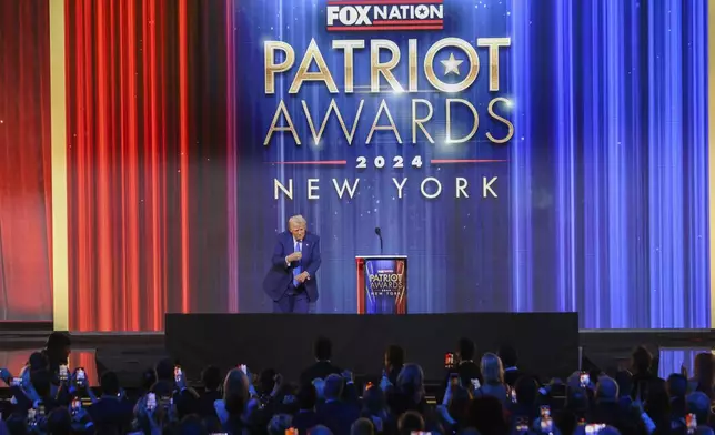 President-elect Donald Trump dances after speaking at the FOX Nation Patriot Awards, Thursday, Dec. 5, 2024, in Greenvale, N.Y. (AP Photo/Heather Khalifa)