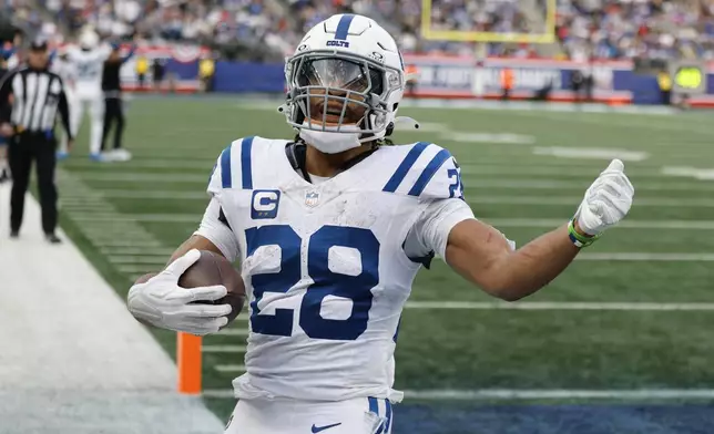 Indianapolis Colts running back Jonathan Taylor scores a touchdown against the New York Giants in the second half of an NFL football game Sunday, Dec. 29, 2024, in East Rutherford, N.J. (AP Photo/Corey Sipkin)