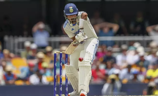 India's KL Rahul bats during play on day three of the third cricket test between India and Australia at the Gabba in Brisbane, Australia, Monday, Dec. 16, 2024. (AP Photo/Pat Hoelscher)