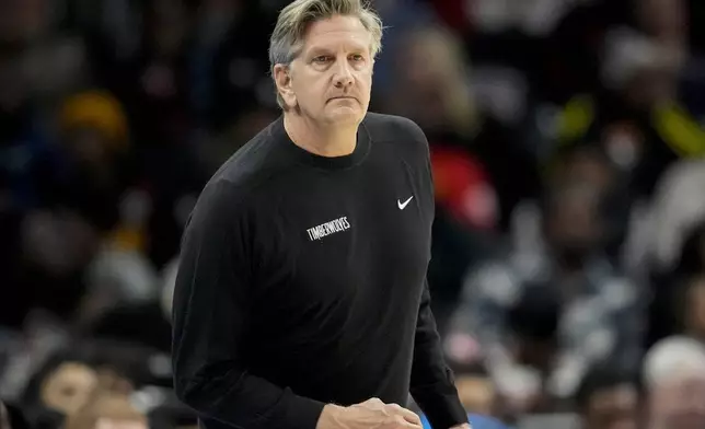 Minnesota Timberwolves head coach Chris Finch watches play against the Atlanta Hawks during the first half of an NBA basketball game, Monday, Dec. 23, 2024, in Atlanta. (AP Photo/Mike Stewart)