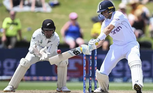 England's Joe Root bats during play on day four of the third cricket test between England and New Zealand in Hamilton, New Zealand, Tuesday, Dec. 17, 2024. (Andrew Cornaga/Photosport via AP)