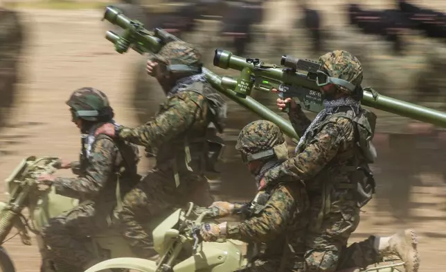 FILE - Fighters from the Lebanese militant group Hezbollah train in southern Lebanon, May 21, 2023. (AP Photo/Hassan Ammar, File)