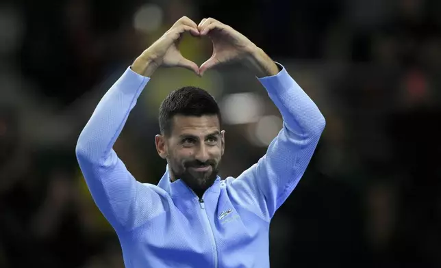 Serbia's Novak Djokovic gestures to the crowd during an exhibition tennis match against Argentina's Juan Martin Del Potro in Buenos Aires, Argentina, Sunday, Dec. 1, 2024. (AP Photo/Gustavo Garello)