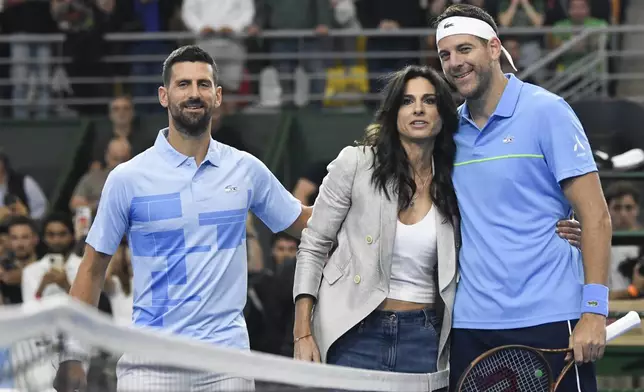 Former tennis player Gabriela Sabatini, center, poses with Argentina's Juan Martin Del Potro, right, and Serbia's Novak Djokovic prior to an exhibition tennis match in Buenos Aires, Argentina, Sunday, Dec. 1, 2024. (AP Photo/Gustavo Garello)