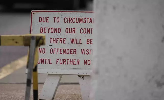 A sign is posted outside of Indiana State Prison on Tuesday, Dec. 17, 2024, in Michigan City, Ind., where, barring last-minute court action or intervention by Gov. Eric Holcomb, Joseph Corcoran, 49, convicted in the 1997 killings of his brother and three other people, is scheduled to be put to death by lethal injection before sunrise Wednesday, Dec. 18. (AP Photo/Erin Hooley)