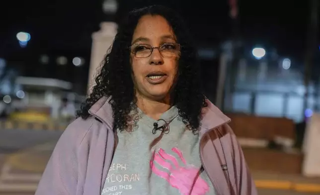 Calling herself his wife, Tahina Corcoran speaks outside of Indiana State Prison on Tuesday, Dec. 17, 2024, in Michigan City, Ind., where, barring last-minute court action or intervention by Gov. Eric Holcomb, Joseph Corcoran, 49, convicted in the 1997 killings of his brother and three other people, is scheduled to be put to death by lethal injection before sunrise Wednesday, Dec. 18. (AP Photo/Erin Hooley)