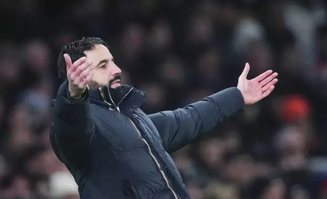 Manchester United's manager Ruben Amorim reacts during the English League Cup quarter-final soccer match between Tottenham and Manchester United, at the Tottenham Hotspur Stadium in London, Thursday, Dec. 19, 2024. (AP Photo/Dave Shopland )