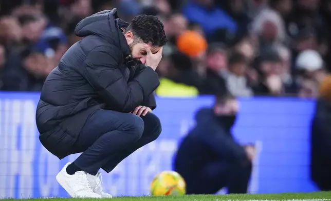 Manchester United's manager Ruben Amorim reacts during the English League Cup quarter-final soccer match between Tottenham and Manchester United, at the Tottenham Hotspur Stadium in London, Thursday, Dec. 19, 2024. (AP Photo/Dave Shopland )