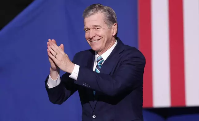 FILE - North Carolina Gov. Roy Cooper arrives to speak at a campaign event in Charlotte, N.C., Sept. 12, 2024. (AP Photo/Nell Redmond, File)