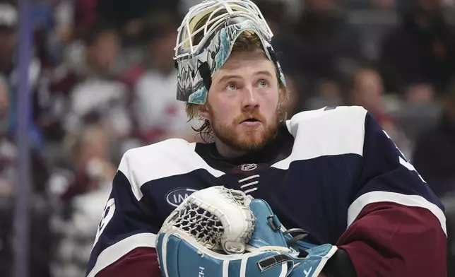 Colorado Avalanche goaltender Mackenzie Blackwood prepares to man the net in the second period of an NHL hockey game against the Nashville Predators, Saturday, Dec. 14, 2024, in Denver. (AP Photo/David Zalubowski)