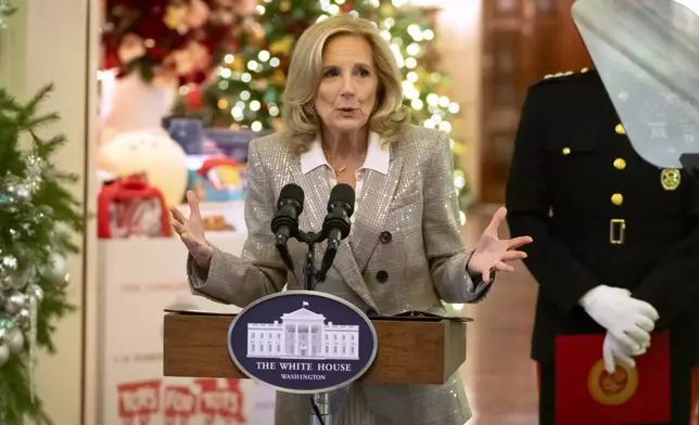 First lady Jill Biden speaks as she hosts a Toys for Tots event with Marine Corps families in the East Room at the White House in Washington, Friday, Dec. 13, 2024. (AP Photo/Mark Schiefelbein)