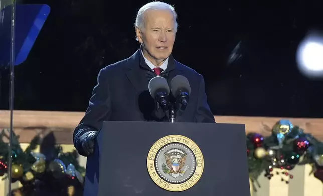 President Joe Biden speaks during a ceremony to light the National Christmas Tree on the Ellipse near the White House in Washington, Thursday, Dec. 5, 2024. (AP Photo/Mark Schiefelbein)