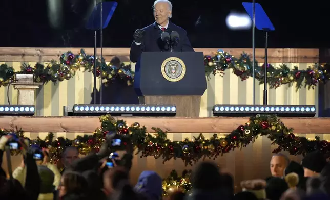 President Joe Biden speaks during a ceremony to light the National Christmas Tree on the Ellipse near the White House in Washington, Thursday, Dec. 5, 2024. (AP Photo/Mark Schiefelbein)