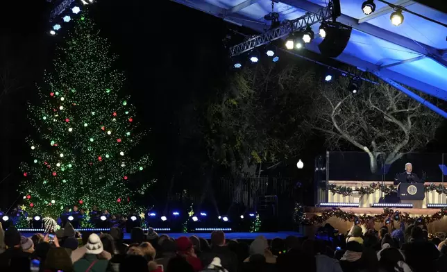 President Joe Biden speaks during a ceremony to light the National Christmas Tree on the Ellipse near the White House in Washington, Thursday, Dec. 5, 2024. (AP Photo/Mark Schiefelbein)