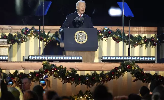 President Joe Biden speaks during a ceremony to light the National Christmas Tree on the Ellipse near the White House in Washington, Thursday, Dec. 5, 2024. (AP Photo/Mark Schiefelbein)